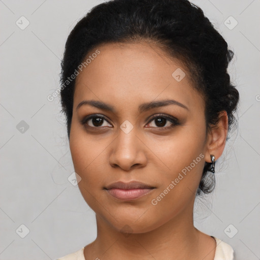 Joyful latino young-adult female with long  black hair and brown eyes