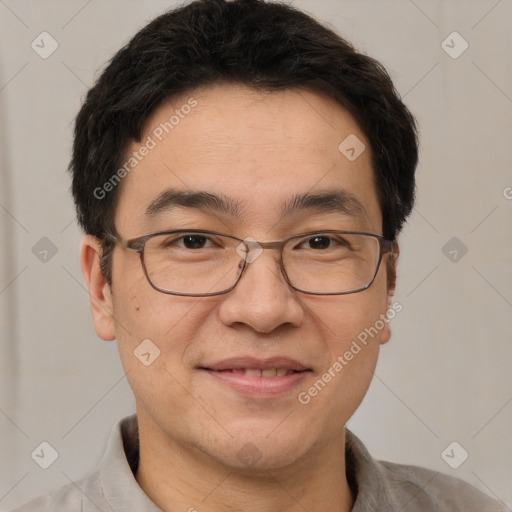 Joyful white adult male with short  brown hair and brown eyes