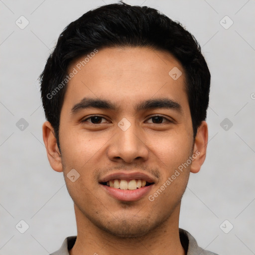 Joyful latino young-adult male with short  black hair and brown eyes