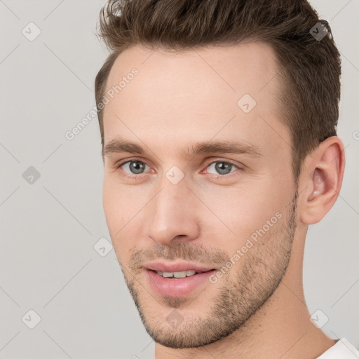 Joyful white young-adult male with short  brown hair and brown eyes