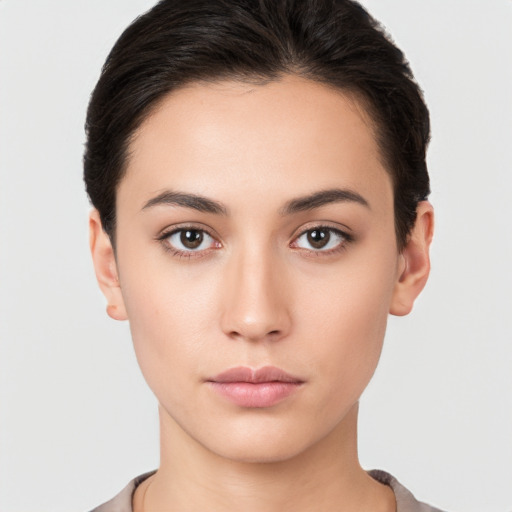 Neutral white young-adult female with short  brown hair and brown eyes