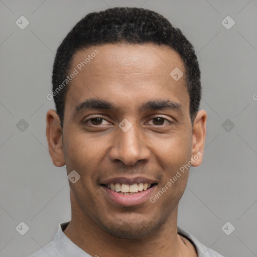 Joyful latino young-adult male with short  black hair and brown eyes