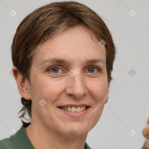 Joyful white adult female with short  brown hair and grey eyes