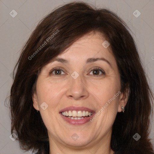 Joyful white adult female with medium  brown hair and brown eyes