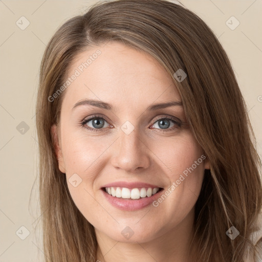 Joyful white young-adult female with long  brown hair and green eyes