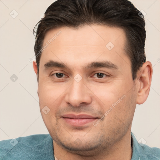 Joyful white young-adult male with short  brown hair and brown eyes