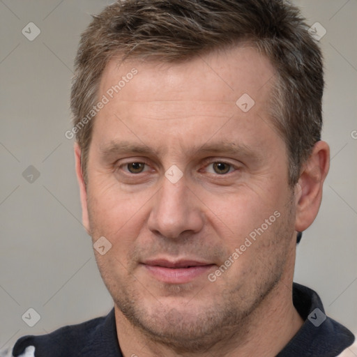 Joyful white adult male with short  brown hair and brown eyes