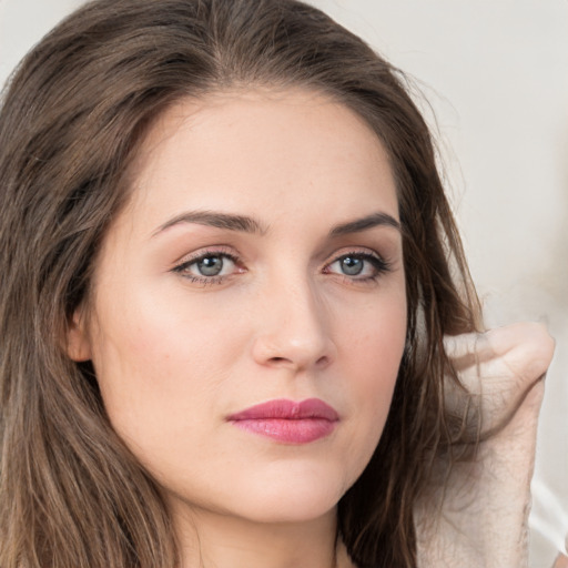 Neutral white young-adult female with long  brown hair and grey eyes