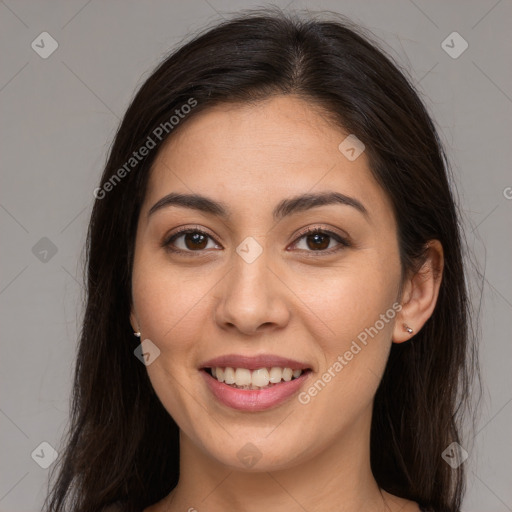 Joyful white young-adult female with long  brown hair and brown eyes