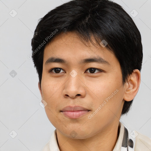 Joyful asian young-adult male with short  brown hair and brown eyes