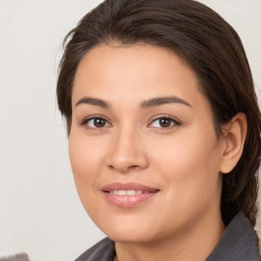 Joyful white young-adult female with medium  brown hair and brown eyes