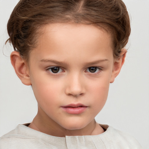 Neutral white child female with short  brown hair and brown eyes