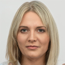 Joyful white young-adult female with medium  brown hair and green eyes