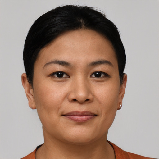 Joyful asian young-adult female with short  brown hair and brown eyes