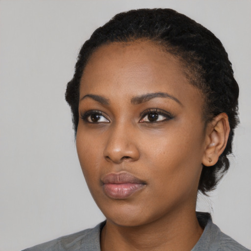 Neutral black young-adult female with short  black hair and brown eyes