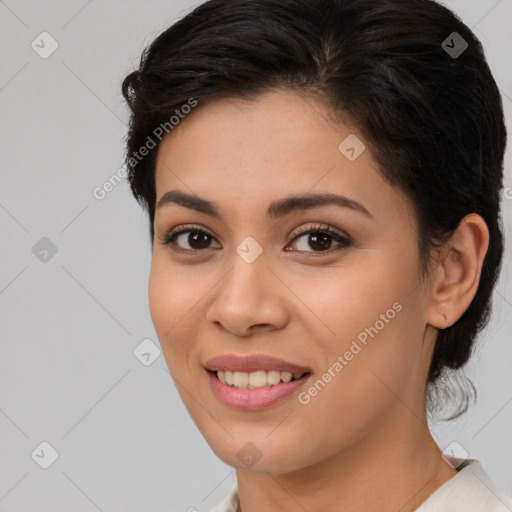 Joyful latino young-adult female with medium  brown hair and brown eyes