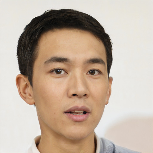 Neutral white young-adult male with short  black hair and brown eyes