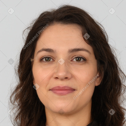 Joyful white adult female with long  brown hair and brown eyes