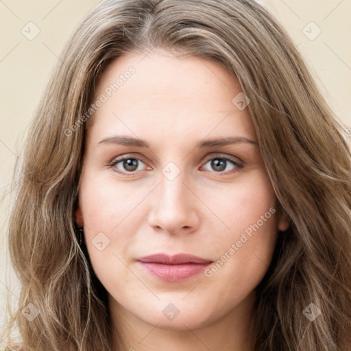 Joyful white young-adult female with long  brown hair and green eyes