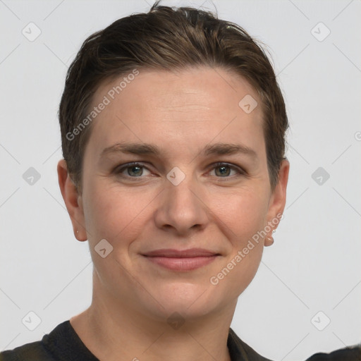 Joyful white young-adult female with short  brown hair and grey eyes