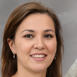 Joyful white young-adult female with medium  brown hair and brown eyes