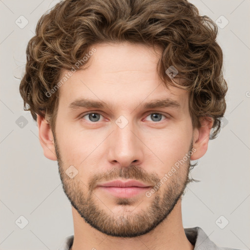 Neutral white young-adult male with short  brown hair and grey eyes