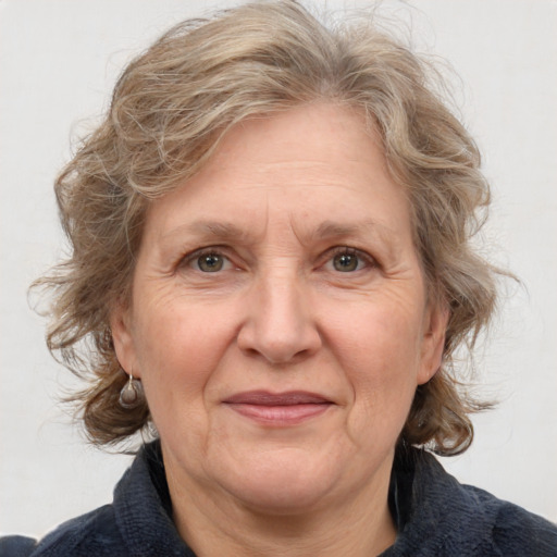 Joyful white middle-aged female with medium  brown hair and brown eyes