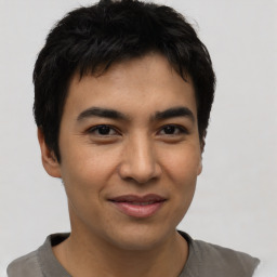 Joyful asian young-adult male with short  black hair and brown eyes