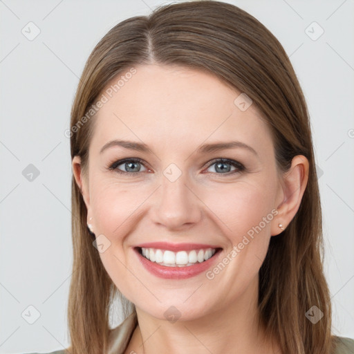 Joyful white young-adult female with long  brown hair and grey eyes