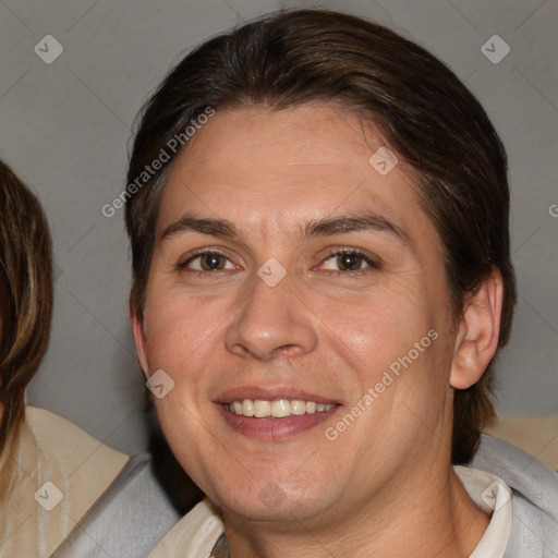 Joyful white adult female with medium  brown hair and brown eyes