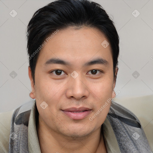 Joyful asian young-adult male with short  brown hair and brown eyes