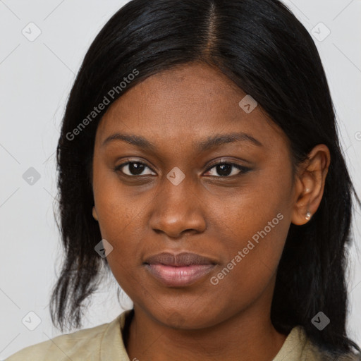 Joyful black young-adult female with long  brown hair and brown eyes