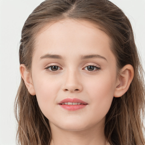 Joyful white child female with long  brown hair and brown eyes