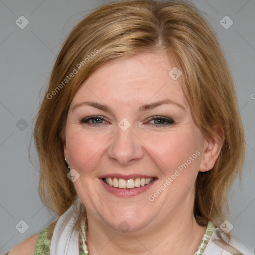 Joyful white young-adult female with medium  brown hair and blue eyes