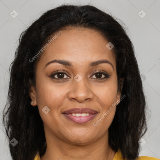 Joyful black adult female with long  brown hair and brown eyes