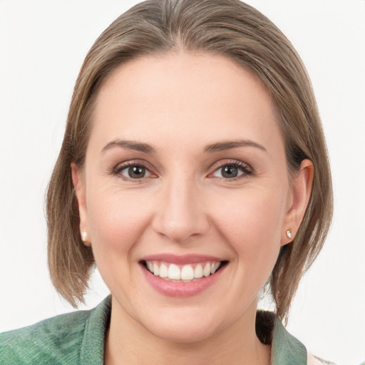 Joyful white young-adult female with medium  brown hair and blue eyes