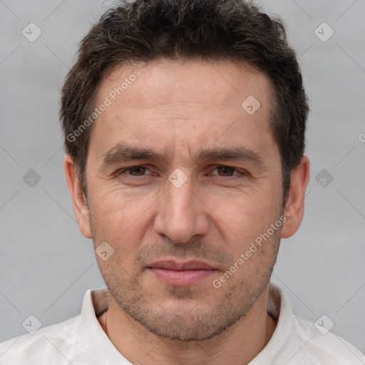 Joyful white adult male with short  brown hair and brown eyes