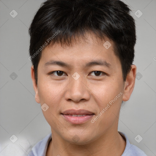 Joyful asian young-adult male with short  brown hair and brown eyes