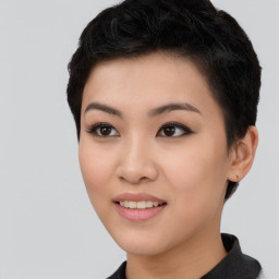 Joyful asian young-adult female with short  black hair and brown eyes