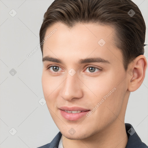 Joyful white young-adult male with short  brown hair and brown eyes