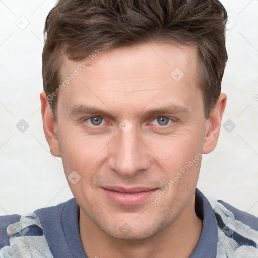 Joyful white young-adult male with short  brown hair and grey eyes