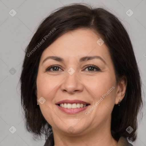 Joyful white adult female with medium  brown hair and brown eyes