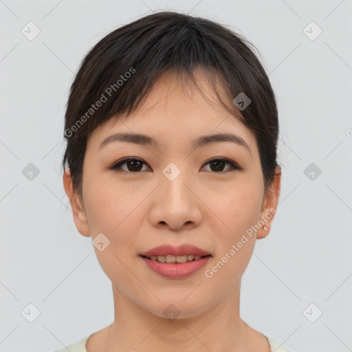 Joyful asian young-adult female with short  brown hair and brown eyes