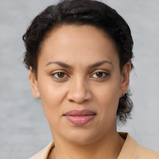 Joyful latino young-adult female with short  brown hair and brown eyes
