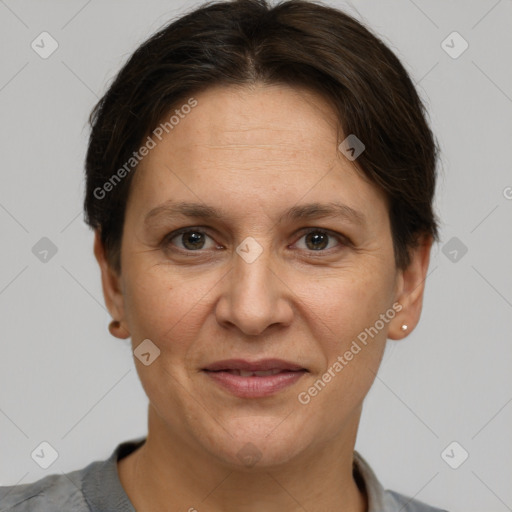 Joyful white adult female with short  brown hair and brown eyes