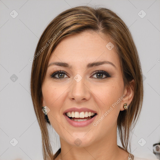 Joyful white young-adult female with medium  brown hair and grey eyes