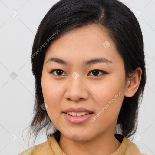 Joyful asian young-adult female with medium  brown hair and brown eyes