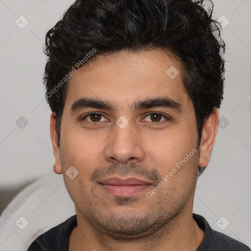 Joyful white young-adult male with short  black hair and brown eyes