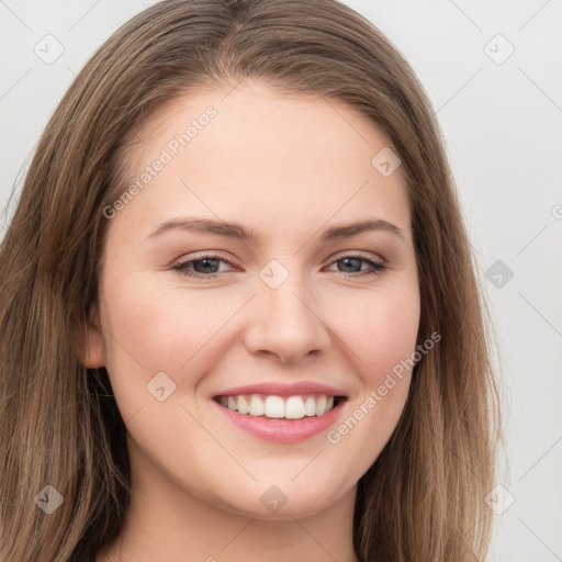 Joyful white young-adult female with long  brown hair and grey eyes