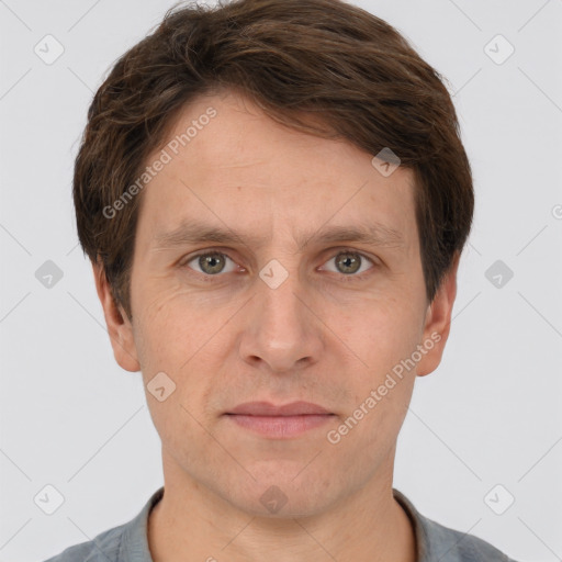 Joyful white adult male with short  brown hair and grey eyes